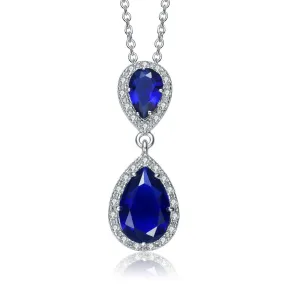 .925 Sterling Silver With Rhodium Plated Two Sapphire Blue Pear With Round Cubic Zirconia Halo Drop Necklace