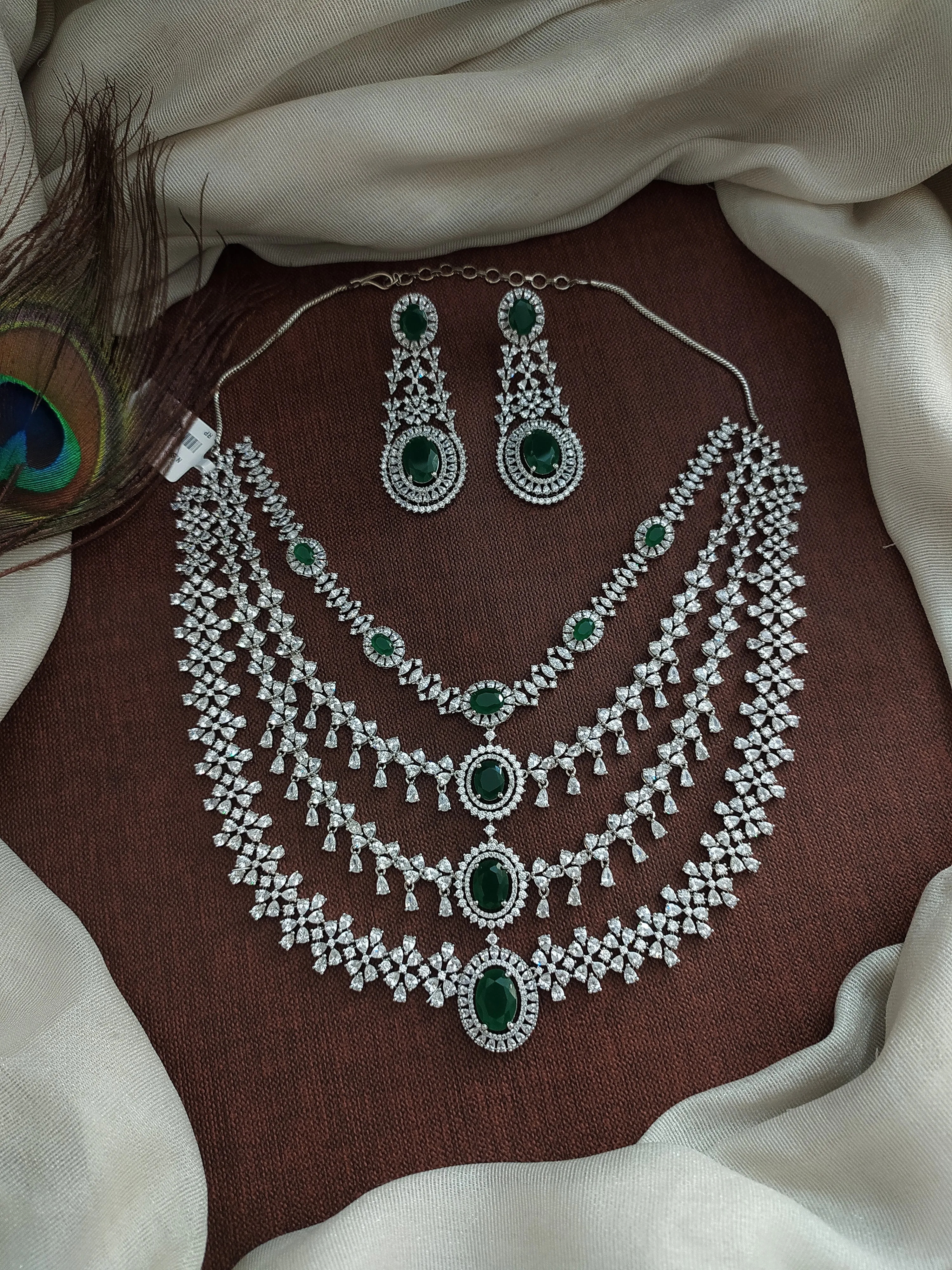 Embrace the captivating beauty of green with Sonal Fashion's Enchanting Emerald Embrace - Green Zircon & Silver Necklace Set!