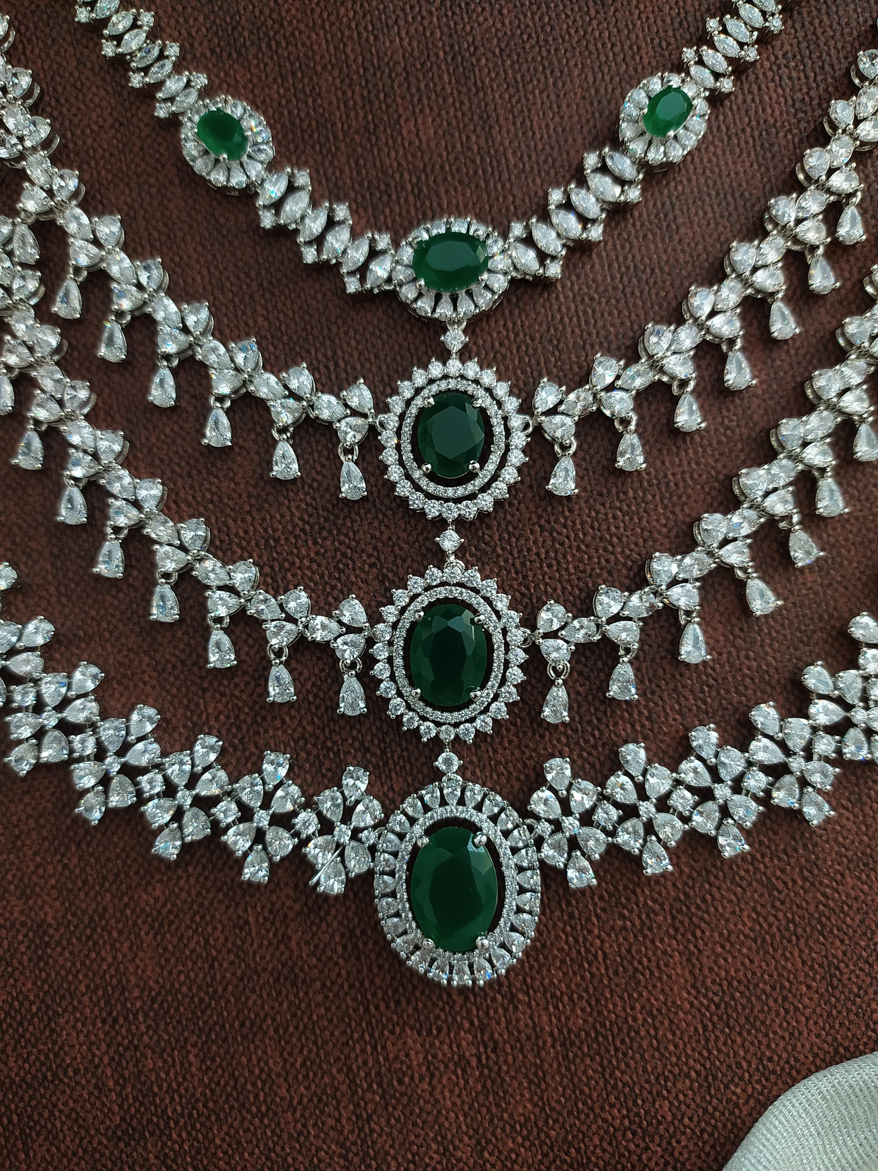 Embrace the captivating beauty of green with Sonal Fashion's Enchanting Emerald Embrace - Green Zircon & Silver Necklace Set!