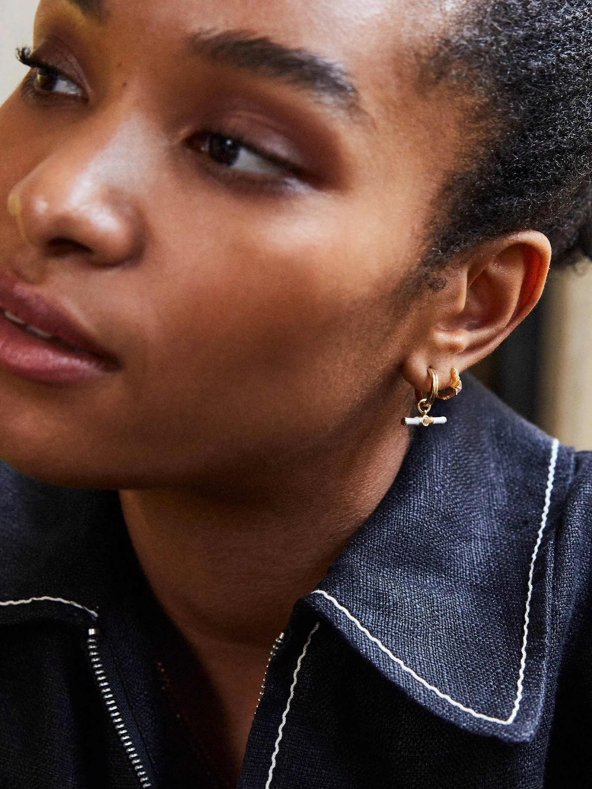 Gold Dyllan hoop earrings with white enamel t-bar charms