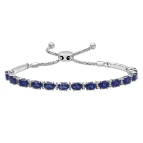 Jewelili Sterling Silver With 6x4mm Oval Created Blue Sapphire and Round White Topaz Bolo Bracelet