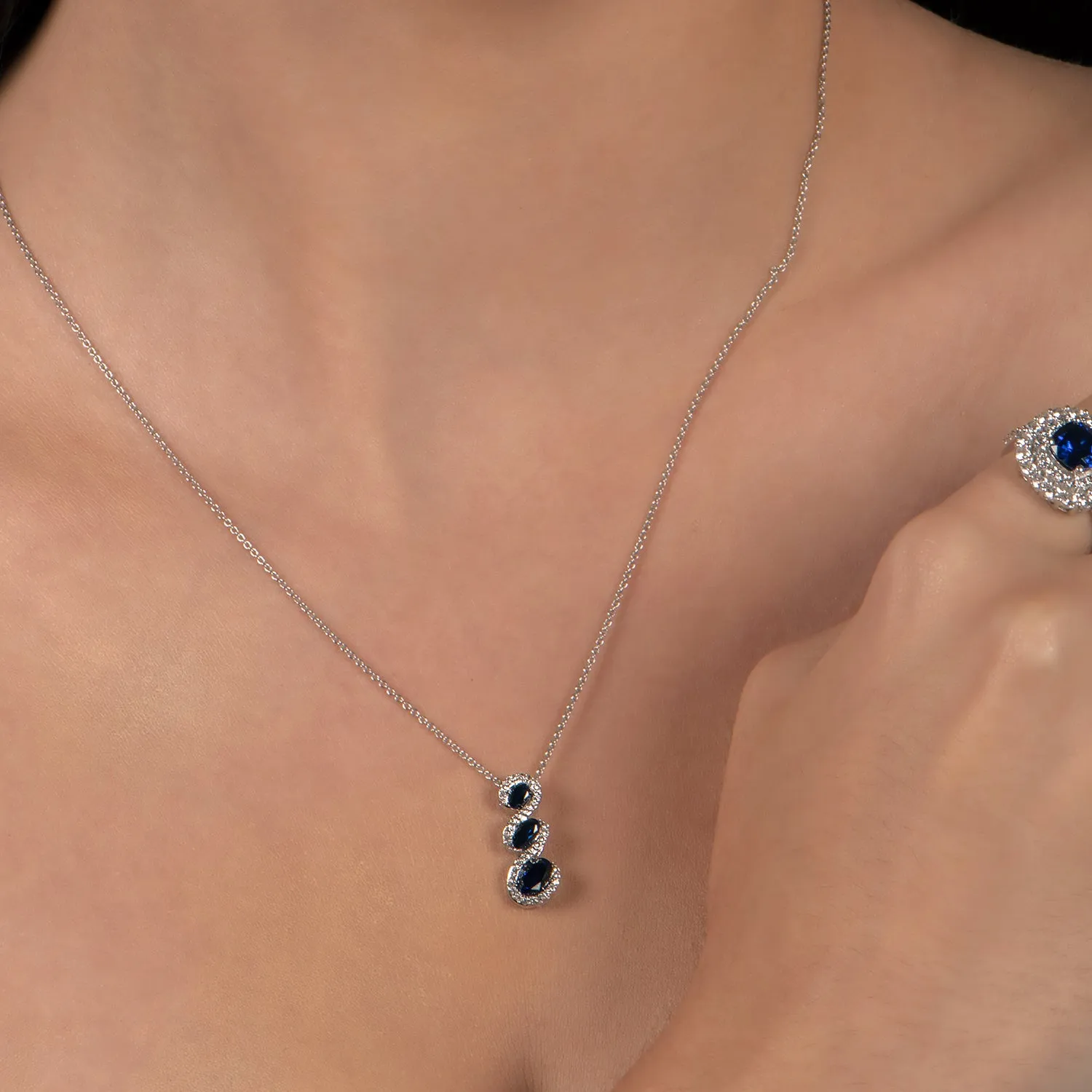 Jewelili Sterling Silver With Created Blue Sapphire and Created White Sapphire Twisted Pendant Necklace