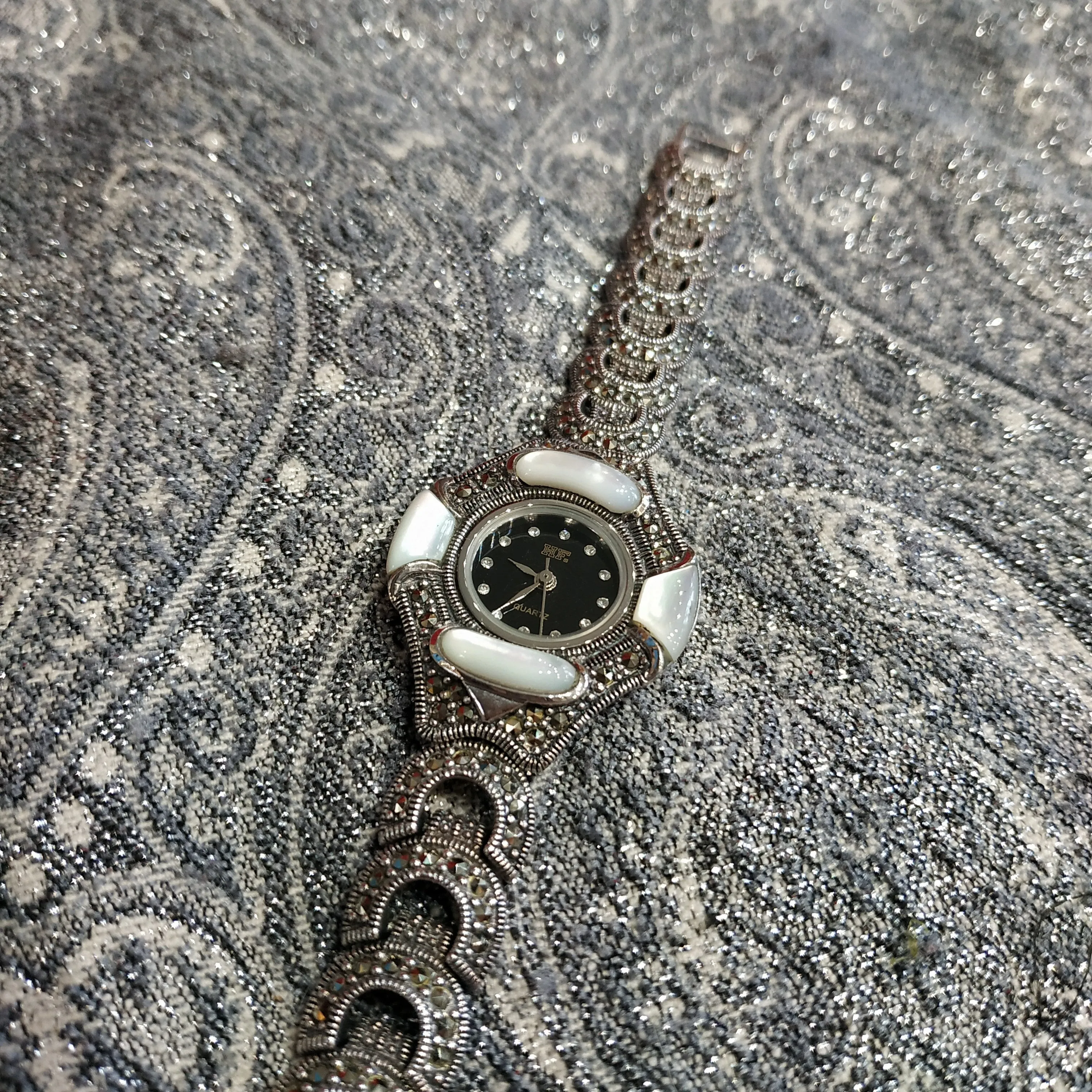 Silver watch with mother of pearl and marcasite