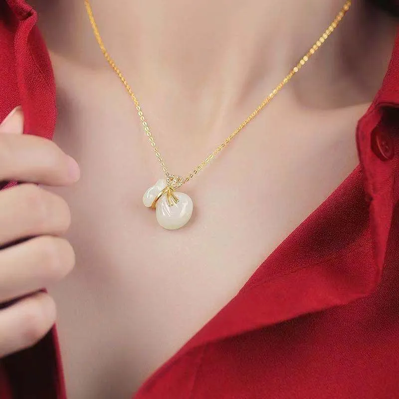White Jade Lucky Money Bag Pendant Necklace with Zircon and Gold Accents
